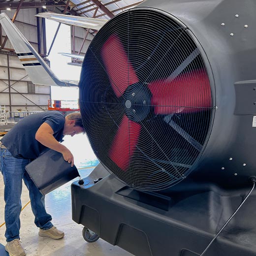 SB Evaps Evaporative Cooler Large Size, Being Filling with Water by a Man